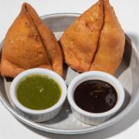 Samosas (VG) by Curry Up Now · By Curry Up Now. 2 pieces. Flaky, handmade empanada-like pastries stuffed with curried potat...
