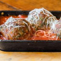 Meatballs · Three house made meatballs in marinara, garnished with aged parmesan and focaccia dipping br...