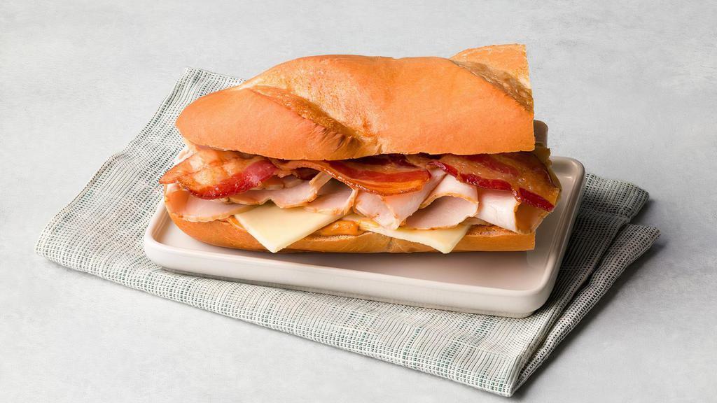 Smoked Turkey · Mesquite Smoked Turkey, bacon, jalapeno pepper jack cheese, chipotle gourmaise served on a French roll.
