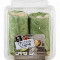 CAESAR WRAP · Grilled white chicken meat, green leaf lettuce, and parmesan cheese wrapped in a spinach tor...