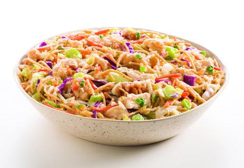 Chinese Chicken Salad · Shredded green and red cabbage with carrots, celery, chicken tenders, and crispy noodles tossed in a tangy dressing.