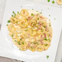 Tortellini Giorgio · Meat (pork and beef) tortellini pasta with Pancetta and peas in a delicious cream sauce