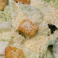 Caesar Salad · Fresh crispy romaine lettuce topped with freshly sliced Parmesan cheese and croutons. Served...