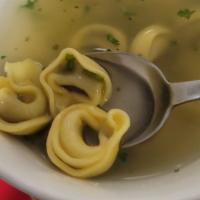 Tortellini in Brodo · Meat tortellini in a delicious chicken broth with a sprinkle of fresh parsley