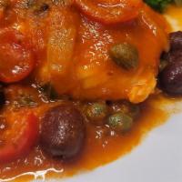 Salmone Livornese · Fresh salmon sauteed with black olives, sweet onions, capers, wine, fresh tomatoes and marin...