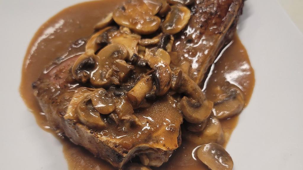 La Bistecca (New York Steak) · New York steak with a mushrooms demi glace sauce, served medium rare