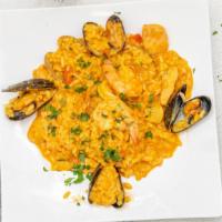 Risotto Frutti di Mare · Clams, black mussels, calamari, shrimp and salmon, with our seafood sauce and a hint of saff...