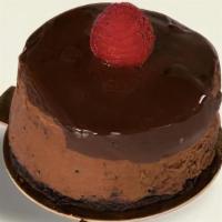 Chocolate Raspberry Cheesecake · Raspberry infused chocolate cheesecake on a chocolate cookie crust