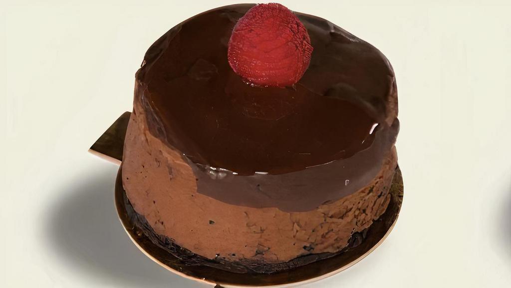 Flourless Chocolate Raspberry Mousse · Flourless Chocolate Cake, Dark Chocolate Mousse, Raspberry Jam and Fresh Raspberries.
