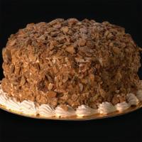 Burnt Almond · Vanilla and chocolate cake filled with Amaretto custard filling, iced with whipped cream and...