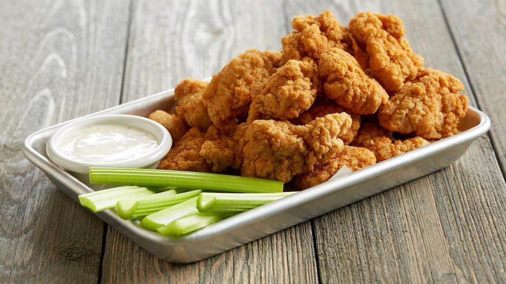 Boneless Wings · A full pound* of all-white-meat boneless wings | tossed in your choice of our signature sauces or dry rubs | served with celery sticks and ranch for dipping   * Pre-cooked weight