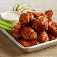 Bone-In Wings · Crispy, bone-in wings | tossed in your choice of  our signature sauces or dry rubs | served ...