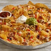 Loaded Nachos · Crispy corn tortilla chips | housemade sriracha queso | melted jack + cheddar cheese | house...