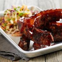 Root Beer Glazed Ribs · Five slow-roasted baby back pork ribs | BJ’s Handcrafted Root Beer glaze | spicy sriracha sl...