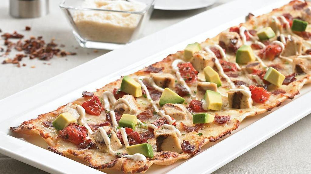California Club Flatbread · Grilled chicken | applewood smoked bacon | seasoned tomatoes | BJ's signature five cheese blend | avocado | a drizzle of roasted garlic aioli