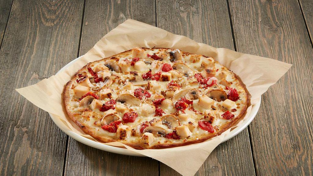 Gluten-Free Great White  ® · Grilled chicken breast, alfredo sauce, mushrooms, roasted garlic, Parmesan cheese and seasoned tomatoes. Served on gluten free pizza crust.