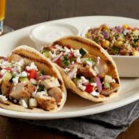 Enlightened Mediterranean Chicken Pita Tacos · Seasoned grilled chicken | cucumbers | tomatoes | red onions | feta cheese | cilantro | red ...