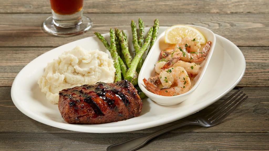 Tri-Tip And Shrimp Scampi Combo* · 6 oz. slow-roasted sirloin tri-tip glazed with BJ's Peppered BBQ sauce | shrimp scampi | choice of two signature sides
