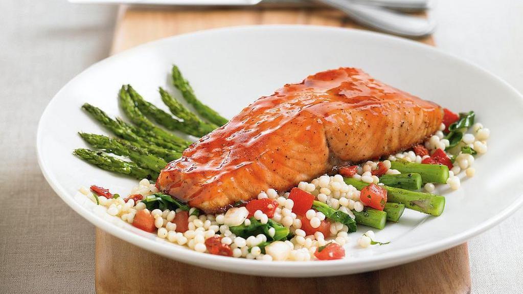Enlightened Cherry Chipotle Glazed Salmon* · Oven-roasted atlantic salmon | sweet, savory cherry chipotle glaze | roasted asparagus | fire-roasted red pepper, tomato + spinach couscous
