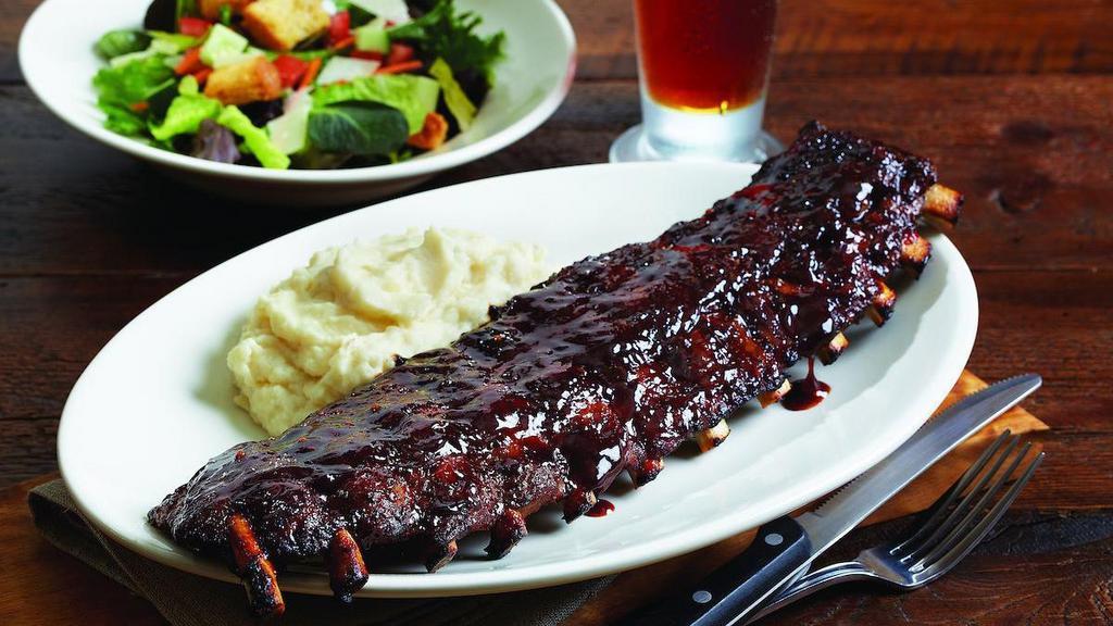 Baby Back Pork Ribs - Full · A full rack of slow-roasted overnight baby back ribs | Big Poppa Smokers’ Sweet Money Championship rub | BJ’s Peppered BBQ sauce | choice of two signature sides
