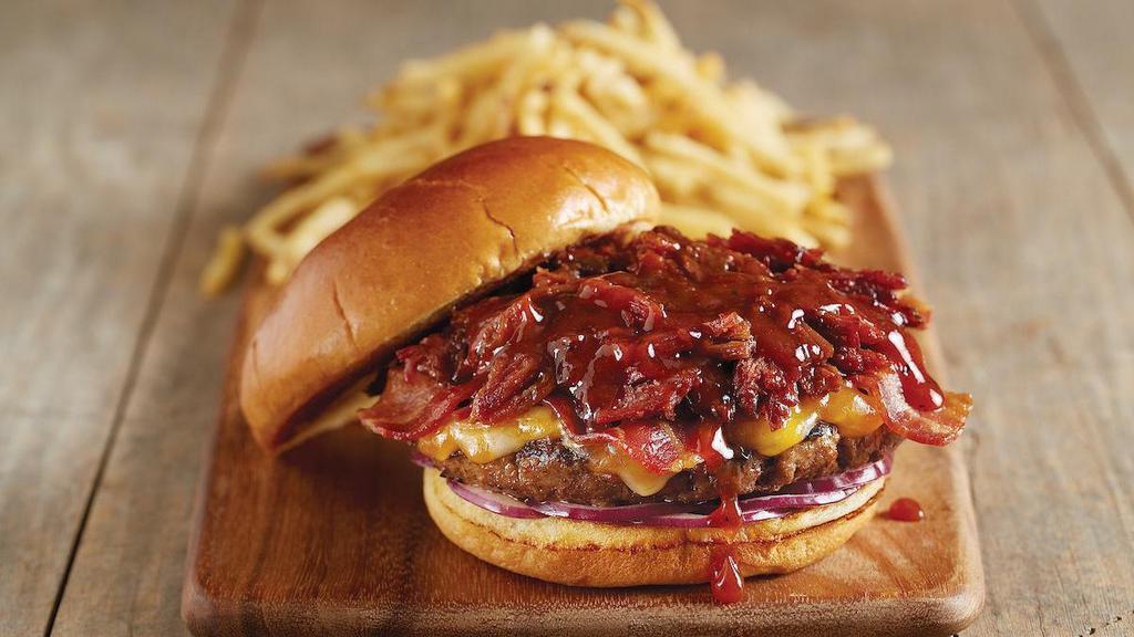 Hickory Brisket And Bacon Burger* · Fire-grilled beef patty | sweet, tangy BJ’s Peppered BBQ sauce | smoked brisket | applewood smoked bacon | jack + cheddar cheese | red onions | mayonnaise | premium parker house bun