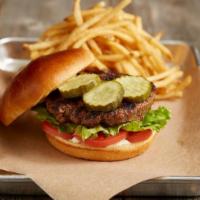 Classic Burger* · Fire-grilled beef patty | tomatoes | lettuce | dill pickles | premium parker house bun | BJ’...