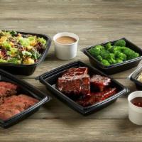 Tri-Tip & Ribs Bundle · 18 oz. Tri-Tip | 4 Quarter Rack Ribs | 2 Family-Sized Sides | 1 Family-Sized Salad  Serves 4