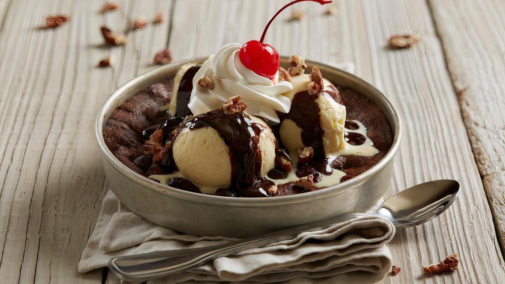 Hot Fudge Brownie Pizookie ® · Warm, gooey brownie | rich vanilla bean ice cream | dark chocolate hot fudge | toasted pecans | whipped cream | topped with a cherry