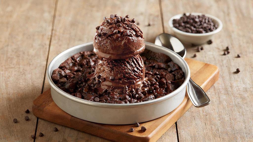 Triple Chocolate Pizookie® Made With Ghirardelli® · Rich chocolate cookie with chunks of Ghirardelli® chocolate | Ghirardelli® double chocolate chip ice cream | Ghirardelli® dark chocolate chips
