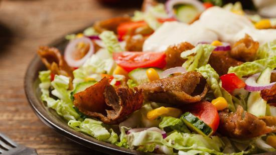 Combo Salad · Half fresh chicken and half beef shawarma salad mixed with feta cheese.