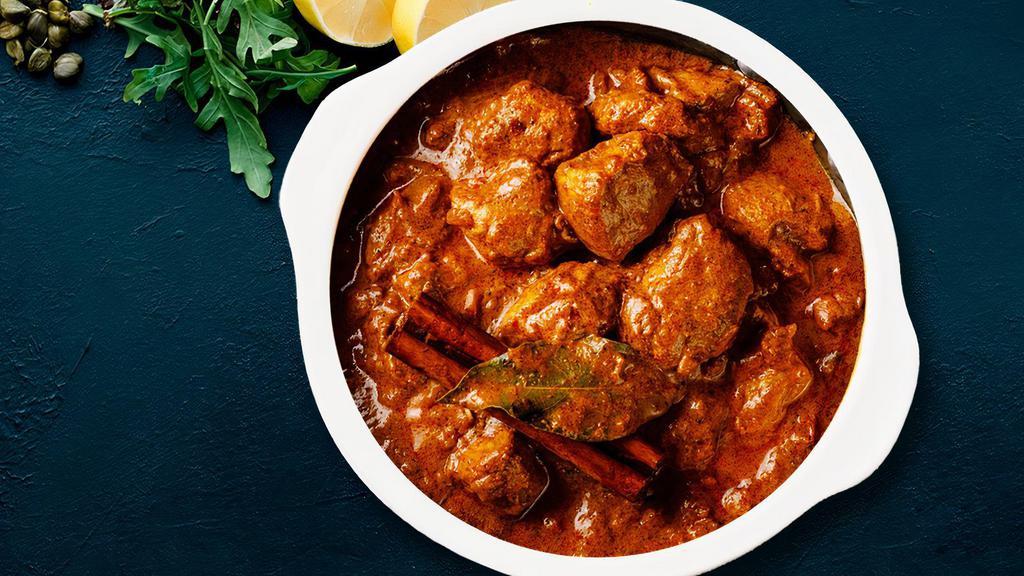 World Famous Chicken Tikka Masala · Chunks of roasted marinated chicken cooked in spiced gravy.