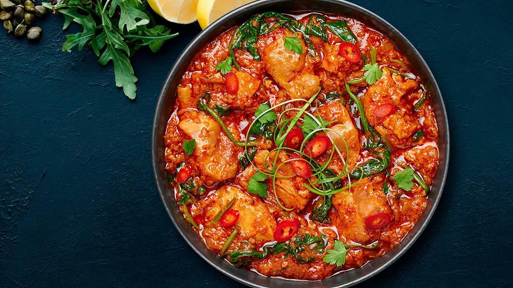 Chicken Vindaloo · Chicken and potatoes sautéed in a spicy, tangy sauce.