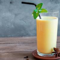 Mango Lassi · A traditional drink of mango purée and homemade yogurt.