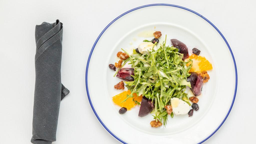 Beet Salad · Arugula with roasted red beets, walnuts, dried cranberries, goat cheese and lemon citrus dressing.