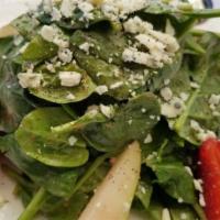 Arugula Salad · Served with shaved Parmesan cheese,sliced apples,red onions and honey-lemon dressing