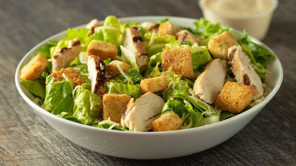 Chicken Caesar Salad · Grilled chicken, Romaine lettuce, garlic croutons, parmesan & a great classic Caesar dressing