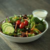 Mixed Greens Salad · Formerly known as Seasonal Greens.  Mixed baby greens, carrots, cucumbers, tomatoes & brocco...