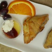 Set of 2 scones · Blueberry, Cinnamon, Raisins, or GF scone served with homemade clotted cream, lemon curd and...