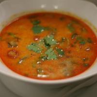 Lemongrass Soup (Tom Yum) · Spicy and Sour soup with Mushrooms, Onion, Tomato, and Cilantro.