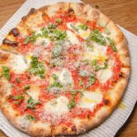Pizza Margherita · Fior di latte mozzarella, tomato sauce, fresh basil, parmesan and good olive oil.