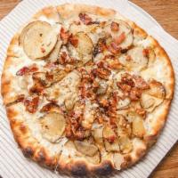 Baked-Potato Pizza · Scalloped potatoes, gruyere cheese, crisp bacon, fresh rosemary and parmesan.