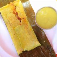 Banana Leaf Tamal · Textured soy protein in savory mole, capers, potatoes, a green olive all inside organic corn...