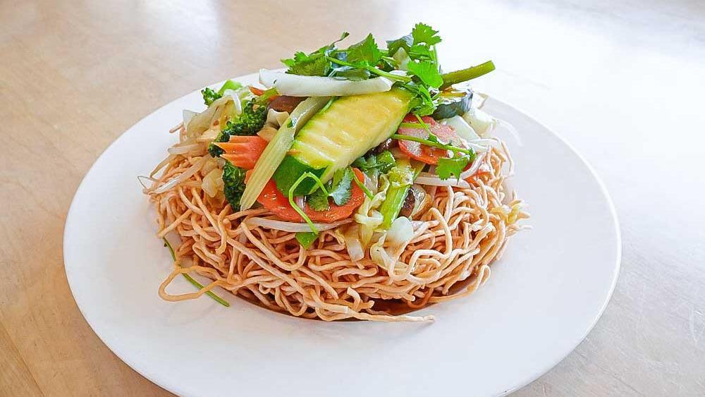 28. Stir-Fried Vegetable Chow Mein /  Mi Xao Mem · Stir-fried garlic with wheat noodle, mixed vegetable, tofu, and mushroom.