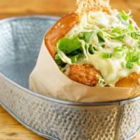 Fish Burger · Fish patty, cabbage salad, cheese, tartar sauce, and a tonkatsu sauce.