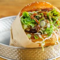 Menchi Katsu Burger · Pork patty covered in breadcrumbs, then deep-fried ,cabbage .peanut lemon  sauce