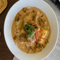 Massaman Curry · Thai massaman curry with coconut milk, onion, potato, carrot, peanut and your choice of meat.