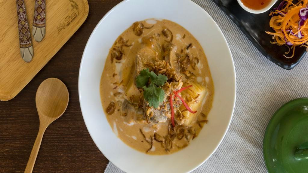Massaman Curry · Thai massaman curry with coconut milk, onion, potato, carrot, peanut and your choice of meat.