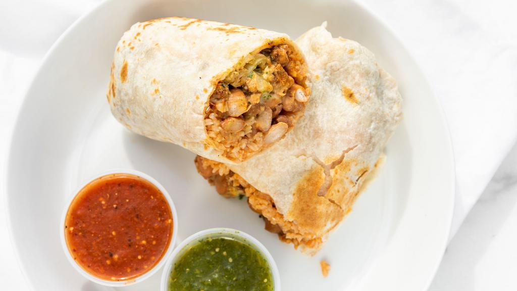 Super Burrito · Beans, rice, choice of meat, onions, cilantro, your choice of salsa, with cheese, guacamole and sour cream.