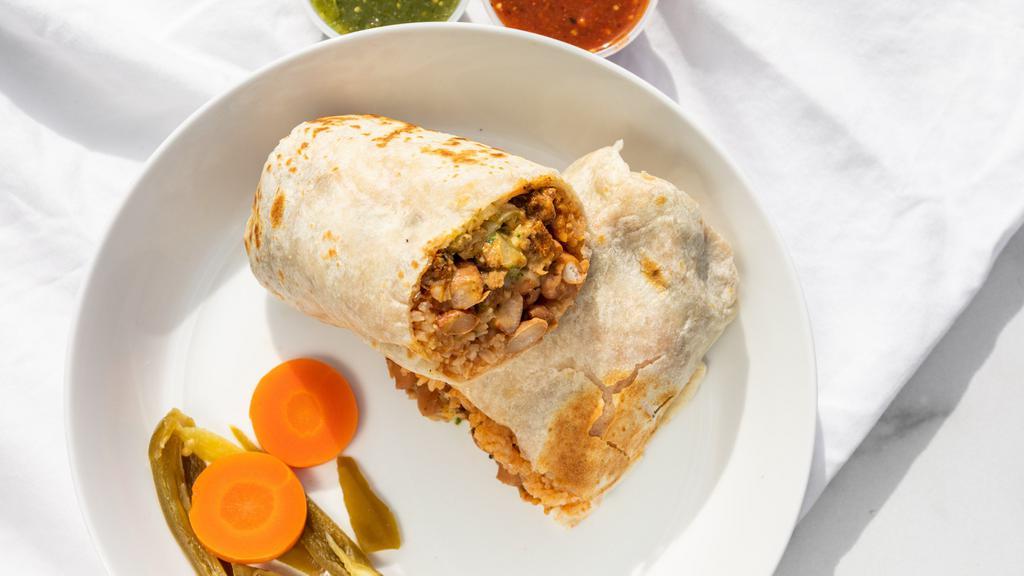 Regular Burrito · Beans, rice, choice of meat, onions, cilantro, and your choice of salsa.