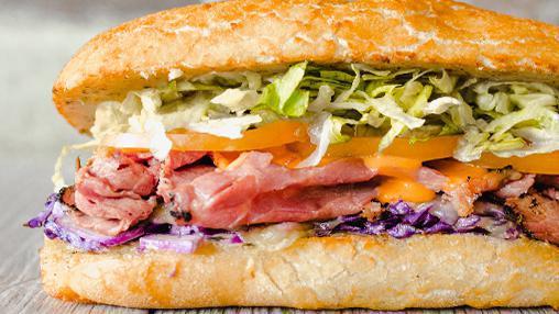 91. PAUL REUBENS · Pastrami, Purple Slaw, French Dressing, Swiss. All sandwiches are served hot with dirty sauce, lettuce, and tomato. [1440 cal]